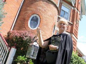 Sheila Gibbs, a guide with Chatham-Kent Ghost Tours, stands in front of The Duchess of Wellington bed and breakfast, one of the many haunted buildings located throughout the municipality. Gibbs will be hosting the Retro Suites Ghost Walk on Friday July 26, 2013, and will take participants on spooky tour of their local community, including an inside look at The Duchess of Wellington. KIRK DICKINSON/FOR CHATHAM DAILY NEWS/ QMI AGENCY