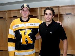 The McGlynn brothers, Conor, left and Brendan, both Kingston Frontenacs draft picks, pose inside the Frontenacs dressing room on Tuesday after Conor, a 2011 draft pick, signed with the Ontario Hockey League team. Brendan, a goalie, was a 2013 selection by Kingston. (Ian MacAlpine/The Whig-Standard)