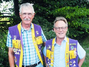 Brian Edwards, the Windham Township Lions Club's current treasurer and an original charter member, stands with Mark Bannister, the club's current president. The club is in search of at least 10 new members or else they will fold at the end of the year. (Sarah Doktor Times-Reformer)