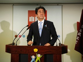 Japan's Prime Minister Shinzo Abe, makes an appearance before the media in Tokyo July 22, 2013.  REUTERS/Issei Kato
