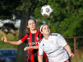 A Quinte Cosmos player heads the ball with a Y'Wanna Have a Cafe/Quinte Old Boys player chasing her during Bay of Quinte Women's Soccer League action last Thursday at Zwick's Park. The game ended in a 2-2 draw.