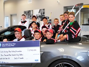 There was nothing but smiling Grizzlies at Doug Hunter Ford in Madoc last Thursday. The company donated nearly $4,000 to the Centre Hastings Minor Hockey Association through their Ford Drive 4UR community program.