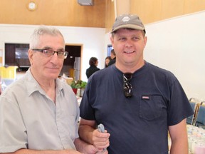 Eli Vuksanovich, left, is stepping down as manager of the Mountjoy Indepndent Farmers' Market and has passed responsibility over to Timmins farmer Allen Graham.
