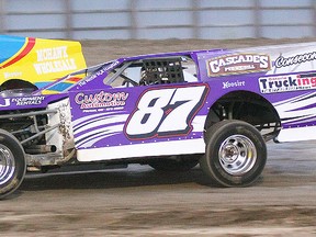 Picton's Andrew Hennessy (87) powers past Kingston's Ryan Scott (33) en route to his third Canadian Modified feature win of the season Saturday at Brighton Speedway.