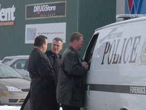 Police investigate a robbery at TD Canada Trust at Cambrian Mall in Sault Ste. Marie, Ont., on March 20, 2013.