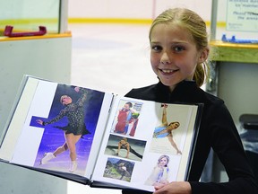 Ella Doherty poses with a book she made depicting her figure skating hero, Joannie Rochette. Rochette was in town to provide a day seminar for the Sherwood Park Figure Skating Club at the Glen Allan Recreation Centre on Tuesday, July 23. Steven Wagers/Sherwood Park News/QMIAgency