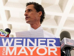 New York mayoral candidate Anthony Weiner and his wife Huma Abedin attend a news conference in New York Tuesday. (Reuters)