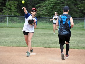 The Eddie Trashcans' Tarsha Autio makes the out at second base and throws to first during the team's game against Melissa's/Taxi Taxi on Sunday, July 21. The Trashcans won 14-12. CORRIE DIMANNO/CRAG & CANYON/QMI AGENCY