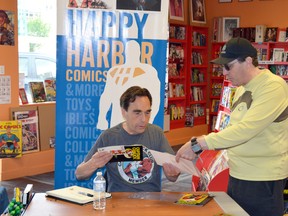 Richard Comely, the creator of Captain Canuck, signed books and answered questions about the Canadian super hero on July 20 at Happy Harbour Comics, 10729 104 Ave. DOUG JOHNSON Edmonton Examiner