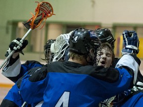 The jr.B Roar lacrosse players celebrate after a big win against the Wheatland Extreme.