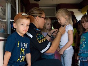 Kids from the Westend Daycare got a visit from an ambulance, Wednesday morning, where the ambulance attendants showed off the stethoscope, the EKG machine, and the horn and sirens. (ROBIN DUDGEON/PORTAGE DAILY GRAPHIC/QMI AGENCY)