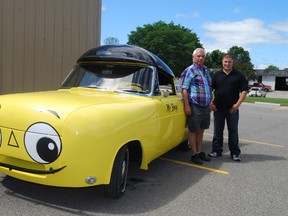 Ross Bonn, left, and Jeff Bonn stand with the fully restored Mr. Beep. Ross Bonn bought the car more than 40 years ago. 
TARA BOWIE / SENTINEL-REVIEW / QMI AGENCY