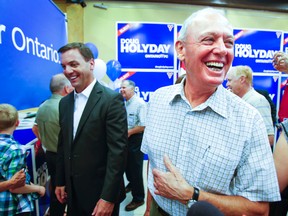 Tory leader Tim Hudak joins Etobicoke-Lakeshore candidate Doug Holyday at the opening of Holyday's campagin HQ.