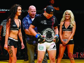 Chris Horodecki holds his spoils following Saturday's win at the Xcessive Force Fighting Championship 2 (Supplied)