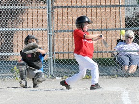 Aiden Meahan of the Port Dover Tim Hortons mosquito baseball team knocks one towards third base during a house league game Wednesday against the Simcoe Lions at the Lions Ball Park. The ball park will be the site of the Simcoe Minor Baseball Association's mosquito and peewee baseball tournament this weekend. (EDDIE CHAU Simcoe Reformer)