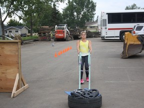 Anne-Marie Nelson practices the tire drag at the Casman Centre parking lot ahead of Saturday’s Femsport Edmonton Challenge. 

Robert Murray/Today Staff