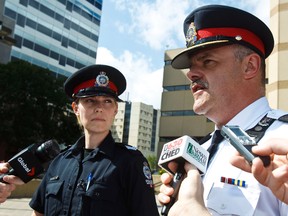 Insp. Blair Edl, right, and Sgt. Rayanne Knox comment on a complaint received by the Edmonton Police Service regarding police response to an intoxicated persons call at the North Millbourne Community League on Monday morning in Edmonton, Alta., on Wednesday, July 24, 2013. Codie McLachlan/Edmonton Sun/QMI Agency