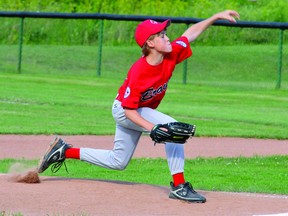 Brockville Minor Braves' Gavin White unleashes a pitch during the team's 18-17 District 7-clinching win over the Cornwall River Rats on Wednesday night at Brackinreid Park. (STEVE PETTIBONE The Recorder and Times)