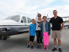 Logan Anshell, Jodie Zach, Lauren and Larry Anshell from Surrey, British Columbia are flying across Canada for the Century Flight Club. They made a stop at the Elliot Lake Airport on Thursday.  
Photo by JORDAN ALLARD/THE STANDARD/QMI AGENCY
