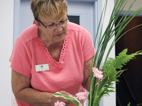 Jeanne Anne Goldrick, president elect of the London Garden Club and a certified Ontario Horticultural Association judge in design is seen hear demonstrating to those in attendance how to manipulate the leaves and create movement in her design.
Photo by Dawn Lalonde/Mid-North Monitor/QMI Agency