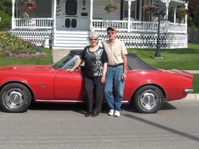 Jean Bradshaw stands with her husband Leo and their '67 Camaro. The Petrolia couple are helping organize the Classic Car Club of Canada's 57th annual Tour to Yesteryear, and 85 classic cars expected to roll into Sarnia-Lambton Sunday for a week of touring. SUBMITTED/ FOR THE OBSERVER/ QMI AGENCY