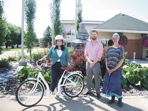 From left: Ellesar Abboud, Devon’s Outspoken campaign leader, who will be spending much of the summer manning the trails and interacting with residents, and Domonic Lodge and Rachel Henderson, summer hires who will be staffing the trial visitors information centre on evenings and weekends in the town office.
