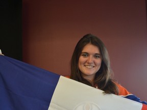 Sixtine Biais, a Rotary exchange student from Bordeaux, France, shows her national pride while wearing her newly acquired Edmonton Oilers jersey. - Thomas Miller, Reporter/Examiner
