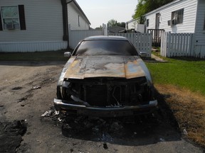 This classic Lincoln was destroyed in a Parkland Village homeowner’s front yard after someone set it on fire for a second time. - April Hudson, Reporter/Examiner