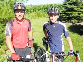 Henry Eising and his son Lucas will ride more than 688 kilometres during the Sea to Sea 2013 Bike Tour. The pair are hoping to raise $10,000 to support poverty awareness initiatives. (SARAH DOKTOR Simcoe Reformer)