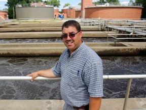 James Taylor, the Ontario Clean Water Agency's local special projects manager, stands at a treatment tank at the wastewater treatment plant in Belleville Thursday. The plant is getting a $10-million upgrade to increase its storage capacity and more.