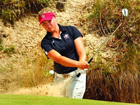 Brooke Henderson of Canada hits out of a bunker onto the 1st green during the third round of the 2013 U.S. Women's Open golf championship at the Sebonack Golf Club in Southampton in June. Henderson is one shot back heading into the final round of this week's Royale Cup Canadian Women's Amateur Championship. (ADAM HUNGER Reuters)