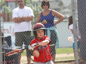 QMI Agency
Matthew Dechant takes a swing during a Mosquito Reds game in Fort McMurray.