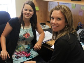 Carly Nienhuis, right, learns about the physician recruiter coordinator position at the Sarnia-Lambton Physician Recruitment Task Force from outgoing recruiter Andrea Hynes. The taskforce has recruited 18 family physicians to Lambton County since 2001. SUBMITTED/ FOR THE OBSERVER/ QMI AGENCY