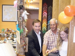 Ontario senior manager for the Canadian Youth Business Foundation, Scott Bowman (left), joins Mayor Dave Canfield and Tangled Tree store owner Jade Lorimer (right) in cutting the ribbon at the grand opening of the business on Thursday, July 25.
ALAN S. HALE/Daily Miner and News