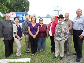 Town staff, fundraising committee members, and local politicians gathered to announce the $80,000 federal grant that will go towards the Centennial Park revitalization project. From left: Deseronto Mayor Norman Clark, Dana Valentyne, Dan Johnston, Tracey Smith, Lisa Brooks, Penny MacLean, Edgar Tumak, Malcolm MacLean, and MP Daryl Kramp.