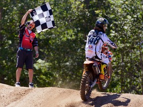 Brigden, Ont.'s Cole Thompson, right, takes the checkered flag in a Monster Energy Motocross Nationals race at Sand Del Lee in Richmond, Ont. on July 20, 2013. (Submitted photo)