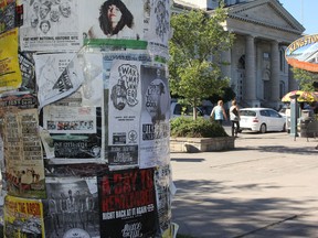 A public notice board set up by the City of Kingston across from city hall is one of the few locations that people and groups are currently permitted to put up posters.