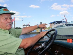 Alex Pawluchyk of Windsor takes a tour through Sarnia Bay Marina Friday for the Third Annual Antique and Classic Boat Show. The event runs Saturday from 9 a.m. to 4 p.m. (TARA JEFFREY, The Observer)