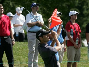 Jesse Smith of Six Nations watches his shot along with the gallery at Glen Abbey Golf Club in Oakville during the second round of the Canadian Open Friday, July 26, 2013. (DARRYL G. SMART Brantford Expositor)