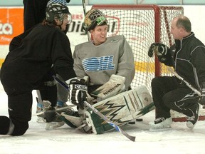 Dave Rook, right, talks to Steve Mason during Rook’s time as goalie coach for the London Knights. Rook is returning to the OHL next season, as goaltending coach with the Sarnia Sting. (File photo)