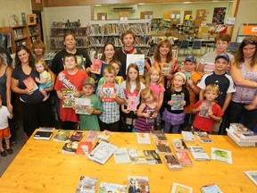 Some members and supporters of Friends of the Library-Hepworth gathered at the library Thursday to show their opposition to the decision to close the branch. (JAMES MASTERS The Sun Times)