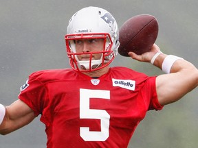 Quarterback Tim Tebow throws a pass as the Patriots open their training camp in Foxboro, Mass., on Friday. (REUTERS/Dominick Reuter)