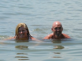 Chris Peters and Lisa Anderson have started their swim from Long Point to Port Dover. They are swimming on behalf of the Canadian Tire Jump Start program, which helps children from cash-strapped families participate in recreation activities. (MONTE SONNENBERG Simcoe Reformer)