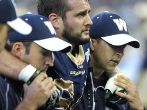 Winnipeg Blue Bombers DT Ryan Lucas is helped off the field after injuring his knee against the Calgary Stampeders in CFL action from Investors Group Field on Fri., July 26, 2013 in Winnipeg, Man. KEVIN KING/Winnipeg Sun/QMI Agency