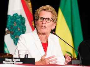 Ontario Premier Kathleen Wynne at a news conference on July 26 2013 during a meeting of Canada's premiers during the Conference of Confederation that was held on Niagara-on-the-Lake, Ont.. (Bob Tymczyszyn/QMI Agency)