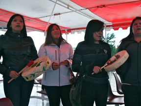 Gena Edwards, far right, sings a song along with her daughter, second from right, and two other members of the Ts'kw'aylaxw First Nation, British Columbia, while on board the MS Kenora. The women sang to thank the Dalles First Nation for welcoming them into the community for their culture exchange.
GRACE PROTOPAPAS/KENORA DAILY MINER AND NEWS/QMI AGENCY
