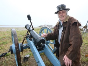Tony Ballard, of Port Elgin,  a member H.M.S. Royal George Boat Society poses with a 3 pounder field gun typical of the ones used during the war of 1812 during the 3rd annual  Marine Heritage Festival in Southampton on Saturday, July 27, 2013.  (The Sun Times/JAMES MASTERS/QMI Agency)