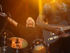 Grand Funk Railroad drummer Don Brewer celebrates early in the Michigan classic rock band's set on Saturday at Harris Park on the third and final day of Rock the Park 2013. Brewer and bassist Mel Schacher are the two original members in the 2013 lineup. JAMES REANEY / THE LONDON FREE PRESS