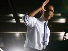 U.S. President Barack Obama gestures while he speaks about the U.S. economy inside the main warehouse at the Jacksonville Port in Florida, July 25, 2013. (REUTERS/Larry Downing)