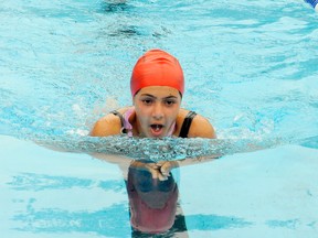 Mikayla Custodio, 12,  of the Delhi Kinsmen Water Dragons competes in the Girls 11-12 50 metre breast swim during the Dave's Variety Invitational Swim Meet at the Kinsmen Pool on Saturday. (DANIEL R. PEARCE Simcoe Reformer)